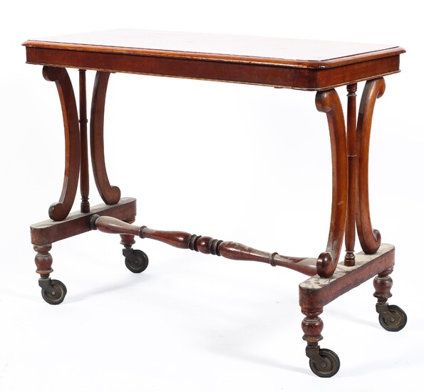 A Victorian mahogany side table, the moulded top above two double scroll and baluster supports