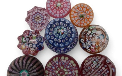 A collection of John Deacons millefiori paperweights one dat...