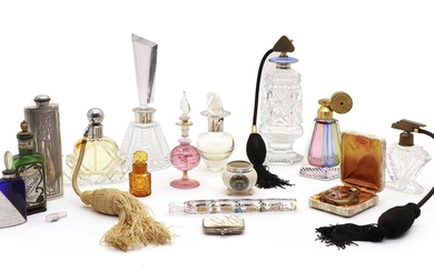 A collection of perfume bottles and dressing jars