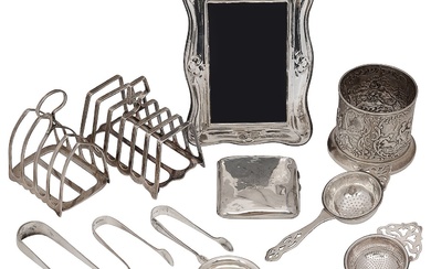 A collection of silver to include a bottle holder and toast racks