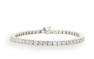 A diamond and fourteen karat white bracelet