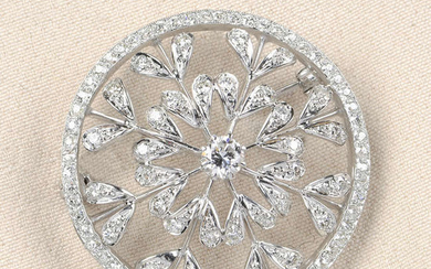 A diamond openwork floral brooch.