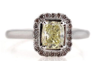 A diamond ring set with a Fancy Light Yellow fancy-cut diamond weighing...