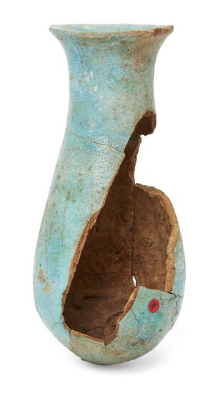 A fragmentary Egyptian blue glazed composition vessel with broad neck expanding to an everted rim, the swollen body narrowing towards the base, New Kingdom, circa 1320-1085 B.C., 14.7cm high Provenance: Formerly in the collection of Werner Forman...