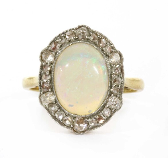 A gold opal and diamond ring