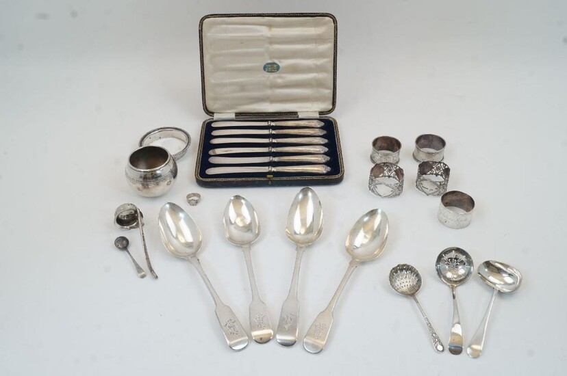 A group of silver oddments and flatware, to include: two fiddle pattern table spoons by Charles Boyton, one London, 1838, the other London, 1830; a George III fiddle pattern spoon, London, 1803, RT; a George IV fiddle pattern spoon, London, 1824...