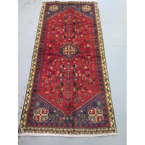 A hand knotted woollen Yallameh rug, 2.00m x .92m, in good c...