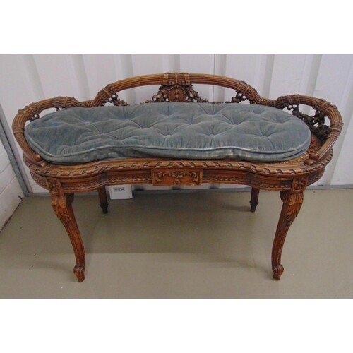 A late 19th century French bedroom seat, shaped oval carved ...