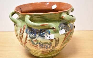 A late 19th early 20th century Brannam Pottery planter, of rustic form, with abstract fish and