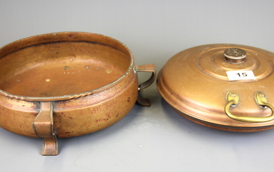 An Art Nouveau hammered copper fruit bowl, D. 23cm, and copper bed warmer.