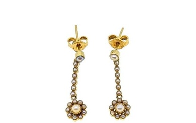 A pair of Edwardian split pearl ear pendants, a row of seven split pearls, terminating in a floral