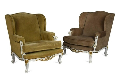 A pair of Louis XV style white and gilt painted wingback armchairs