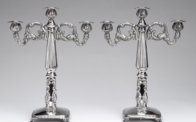 A pair of Spanish silver candelabras
