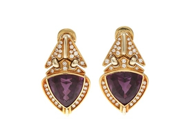 A pair of amethyst and diamond ear pendants each set with a fancy-cut amethyst and numerous brilliant-cut diamonds, mounted in 18k gold and white gold. (2)