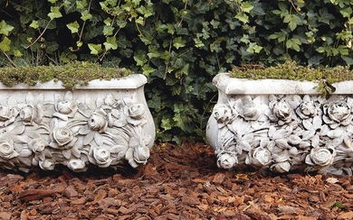 A pair of carved Carrara marble planters