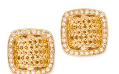 A pair of eighteen karat gold and diamond earclips