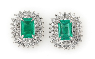 A pair of emerald and diamond ear studs each set with an...