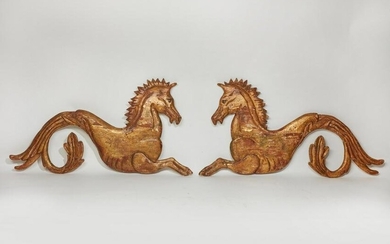 A pair of giltwood hippocamp reliefs
