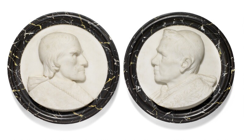 A pair of round Italian Carrara white marble plaques each with portrait of a Pope in profile, profiled marbled frame. Mid-19th century. Diam. 47.5 cm. (2)