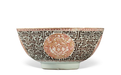 A rare molded gilt-decorated iron-red 'medallion' bowl, Qing dynasty, Kangxi period | 清康熙 礬紅彩描金浮雕錦紋開光花鳥紋盌