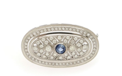 A sapphire and diamond brooch set with a circular-cut sapphire and numerous brilliant-cut diamonds, mounted in 18k white gold. L. app. 3.9 cm.