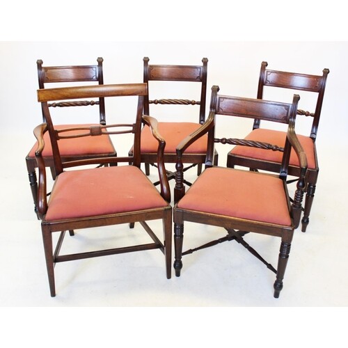 A set of four Regency mahogany dining chairs, each with a ro...