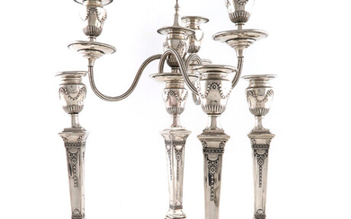 A set of four Victorian silver candlesticks with a matching four-light candelabra branch
