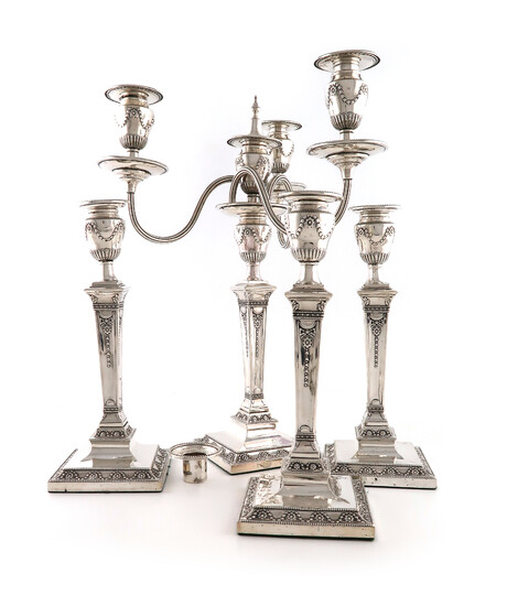 A set of four Victorian silver candlesticks with a matching four-light candelabra branch