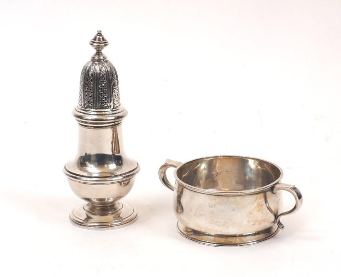 A silver sugar caster, 1974, William Comyns & Sons, together with a George V silver porringer, Birmingham, c.1919, Wilson & Gill, the baluster-shaped body with reeded girdle to a pierced domed lid, 16.6cm high, the porringer with twin scroll...