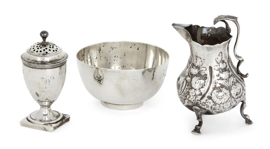 A small George III footed bowl, London, 1782, Edward Fernell, 4.7cm high, 8.6cm dia., together with a George III silver cream jug, London, 1732 (damaged), maker's mark rubbed; and a George III silver pepper, London, 1818, maker's mark rubbed, of...