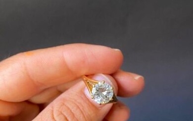 A solitaire ring in yellow gold with a...
