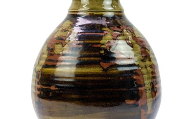 A studio pottery vase. With tenmoku and celadon glaze. MC se...