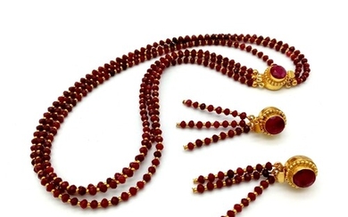 A very elegant, three strand necklace and earrings set with ...