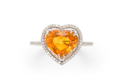 A yellow sapphire, diamond and fourteen karat white gold ring