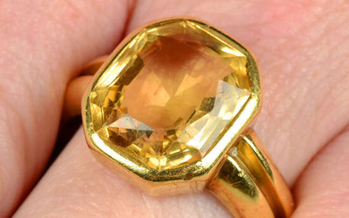 A yellow topaz single-stone ring.