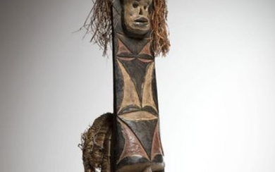 AFIKPO, Nigeria. Polychrome mask with a concave face...