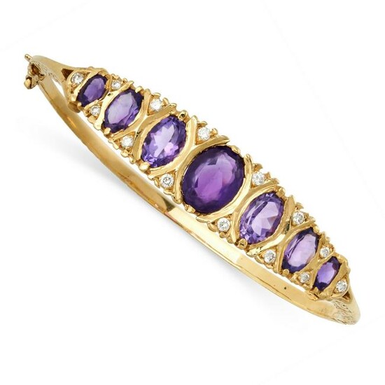 AN AMETHYST AND DIAMOND BANGLE in 9ct yellow gold, the
