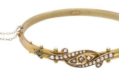 AN ANTIQUE SEED PEARL, PERIDOT AND DIAMOND BANGLE BY DUNKLINGS