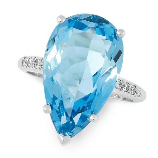 AN AQUAMARINE AND DIAMOND DRESS RING set with a pear