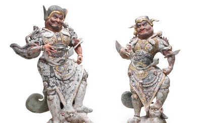 AN IMPRESSIVE PAIR OF PAINTED AND GILT POTTERY FIGURES OF LOKAPALAS