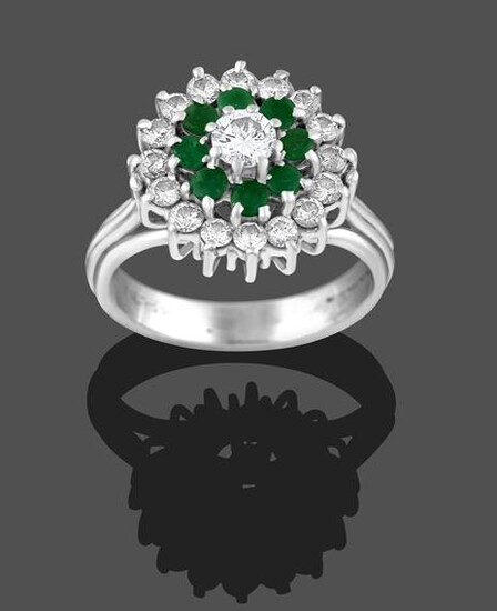 An 18 Carat White Gold Emerald and Diamond Cluster Ring,...