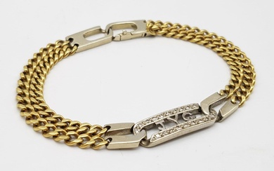 An 18K Yellow and White gold Diamond Bracelet. A...