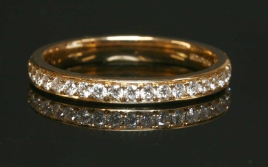 An 18ct rose gold half eternity ring