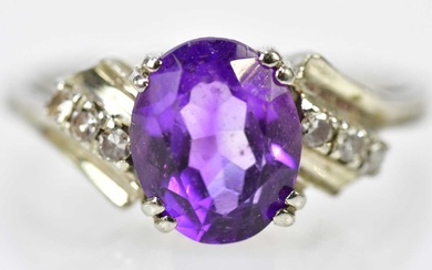 An 18ct white gold amethyst and diamond dress ring, size...