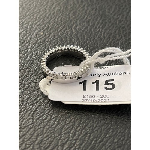 An 18ct white gold wedding band, shaped to be connected to a...