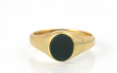 An 18ct yellow gold signet ring, the oval bloodstone leading...