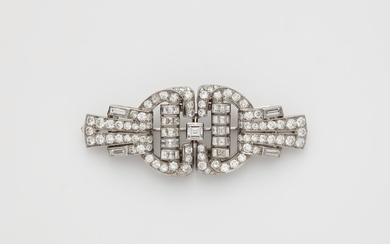 An Art Déco 18k white gold and diamond double clip brooch.