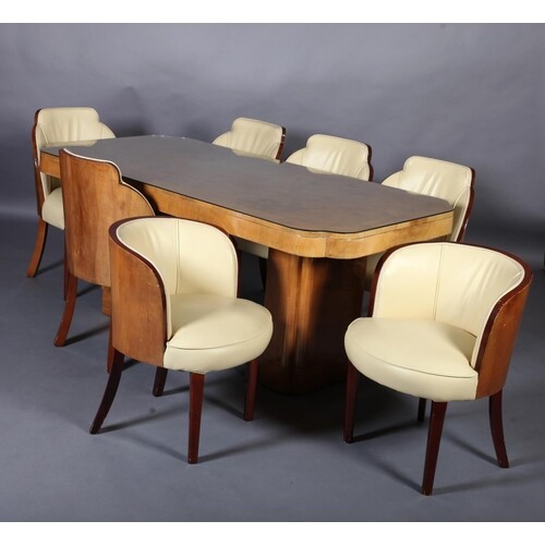 An Art Deco figured and crossbanded walnut dining table and ...