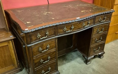 An Edward VII Chippendale style mahogany and leather topped ...