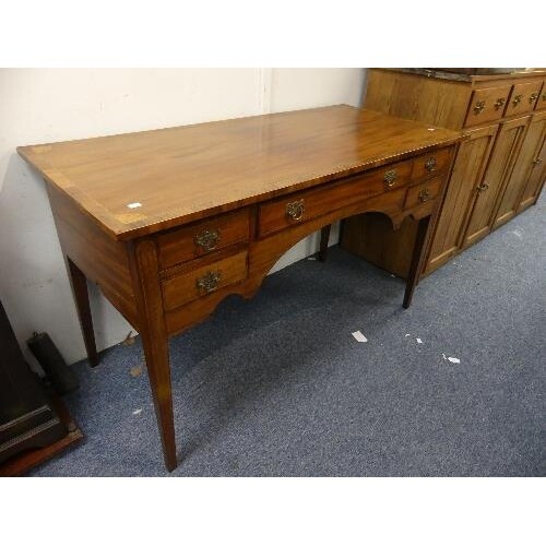 An Edwardian mahogany Lady's Desk, the half venereed top, en...